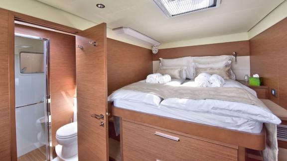 Cozy cabin with elevated double bed and direct access to the bathroom on Lagoon 450F Adriatic Tiger