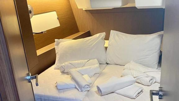 The double cabin of yacht Clio is prepared for a comfortable crewless sailing vacation.