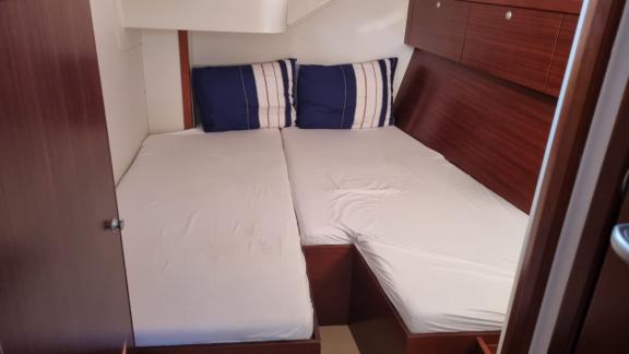 The spacious cabin on the Princess Ela yacht features modern design and a comfortable bed for a relaxing stay.