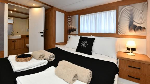 The luxurious guest cabin of Gulet Nayk 2 offers comfort and privacy with an en-suite bathroom.