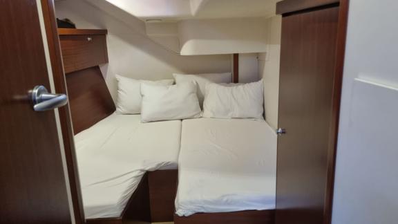 The cabin on the Princess Ela yacht offers soft beds and a spacious interior for a restful sleep.