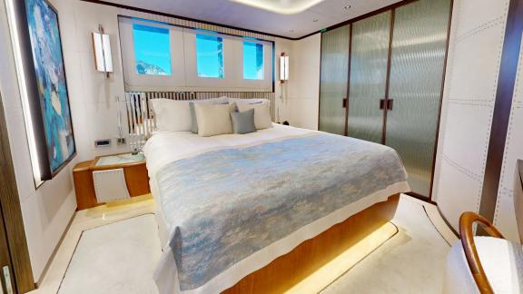 The guest cabin on Eternal Spark features modern interiors and elegant comfort during luxury yacht charter stays.