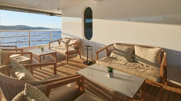 Relaxation area on the yacht with stylish furniture and sea views.