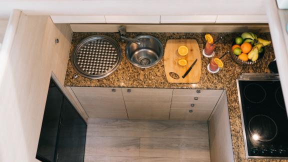 Secret features a modern galley for weekly motor yacht charters and comfortable sea holiday experiences in Mykonos.
