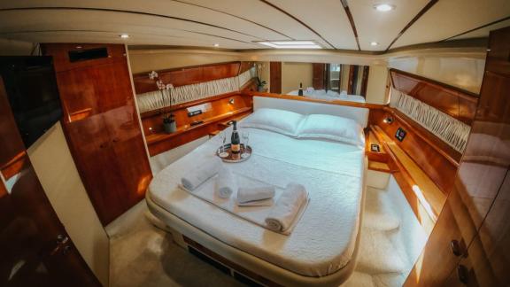 Secret features a spacious master cabin for private motor yacht charters and comfortable yacht accommodation in Mykonos.