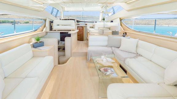 Secret features a spacious interior salon for VIP motor yacht charters and comfortable blue cruise experiences in Mykono