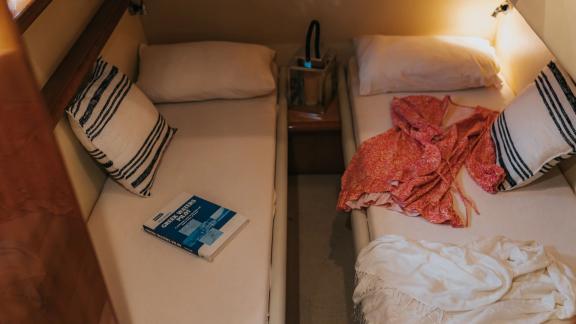Secret features a twin guest cabin for family friendly motor yacht charters and relaxing blue cruises in Mykonos.