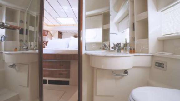 Secret features a modern ensuite bathroom for luxury motor yacht charters and comfortable yacht accommodation in Mykonos