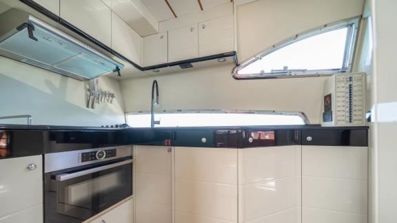 Simply Brilliant features a fully equipped galley for comfortable stays and luxury motor yacht charters in Mykonos.