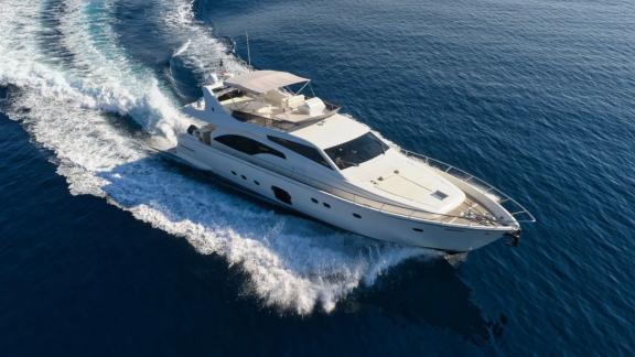 Ferretti 681 Dominique is captured from above while cruising at speed across open waters.