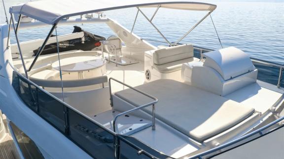 Ferretti 681 Dominique features sun pads, lounge seating and a shaded flybridge area for relaxation.