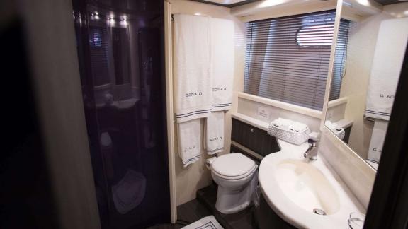 Among Athens yacht rental options Sofia D bathroom shows shower cabin and sink with modern design.