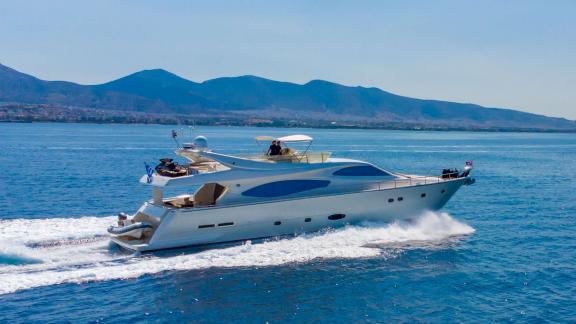 Among Athens yacht rental options Sofia D is seen cruising at high speed with sleek modern exterior design.