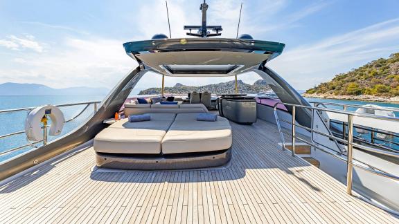 Spacious sun lounger on a motorboat with stunning views of the Greek islands.