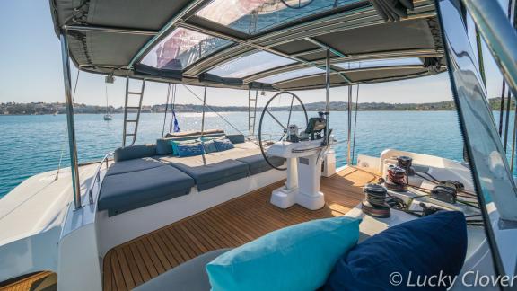 The elegant helm station of Catamaran Lucky Clover offers comfort and stunning sea views.