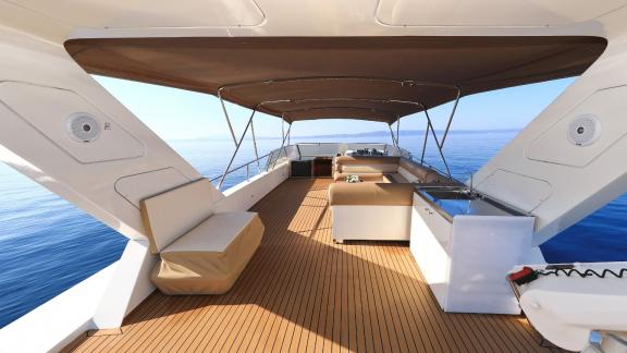 The upper deck of motor yacht Custom Blanka features a spacious and comfortable seating area.