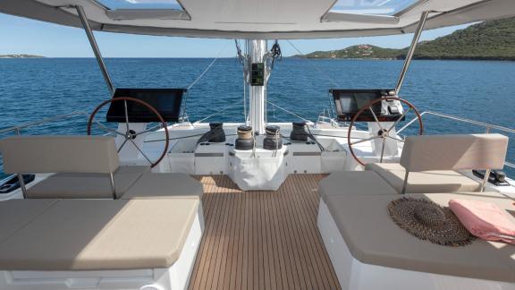 Modern helm station on the Serenissima catamaran with a wide view of the sea.