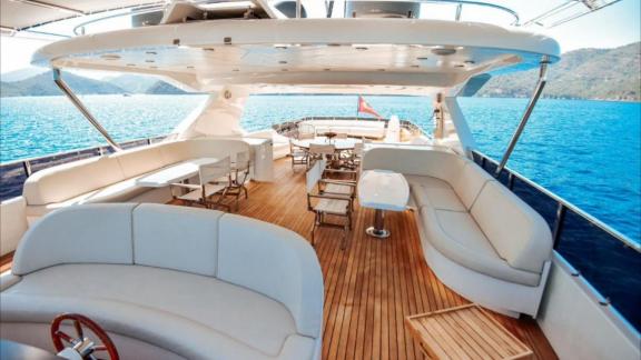 Among Göcek yacht charter options the 5 cabin 10 guest River Storm motor yacht features a flybridge with seating and din