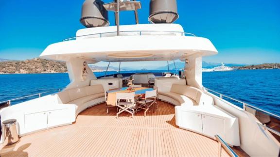 Among Göcek yacht charter options the 5 cabin 10 guest River Storm motor yacht features a flybridge with lounge seating.
