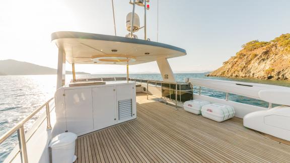 The upper deck of Floki trawler yacht offers spacious seating and relaxation areas.