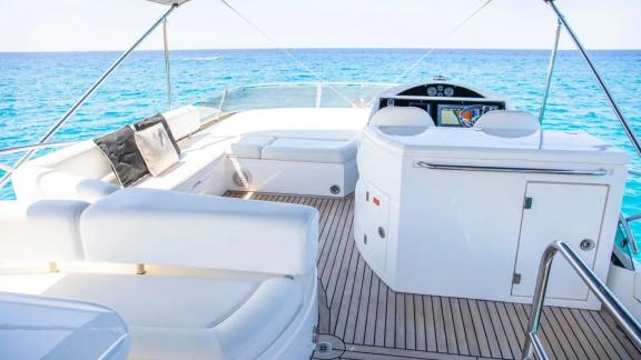 Spacious deck with comfortable seating on the Midnight Summer Dream motor yacht.