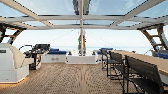 Relax on the stylish upper deck of the Adara Next catamaran, sailing from Athens with a stunning view.