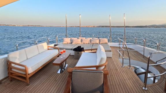 Spacious cushioned sofas offer the perfect spot to relax and enjoy the stunning sea views.