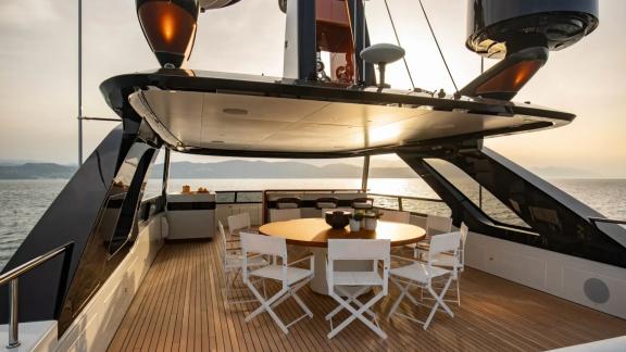 Sunset dining setup with round table on Dawo’s flybridge.