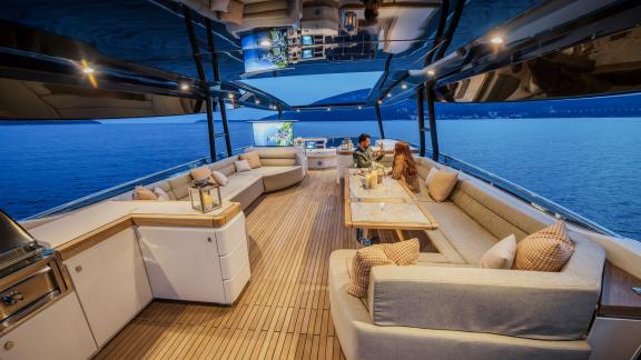 Monte Carlo 86 Giorgio features a flybridge dining area with panoramic sea views.
