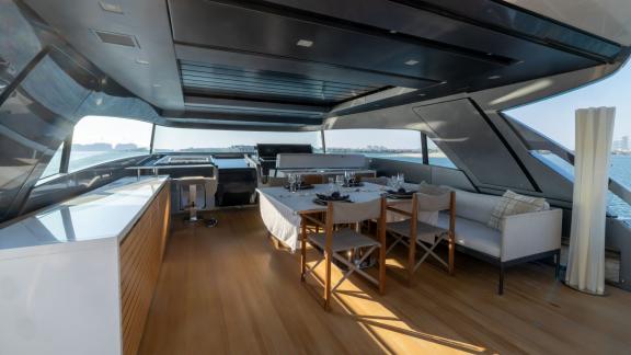 The modern dining area of the San Lorenzo Sx88 yacht provides the perfect setting for a luxury yacht rental in Dubai.