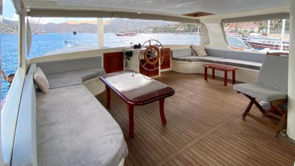 The upper deck of gulet Rose Sah features a spacious seating and relaxation area.