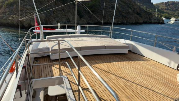 On the upper deck of Angelo 3, a comfortable seating arrangement and a spacious sunbathing area.