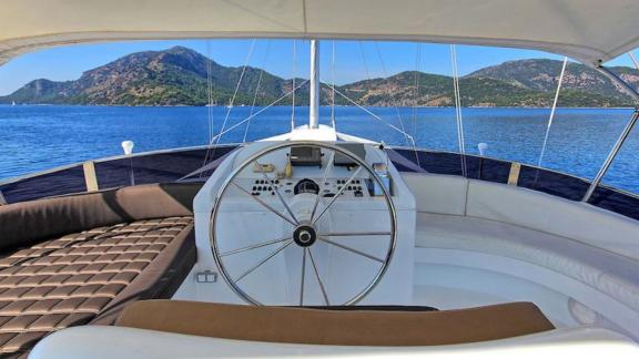 Angelo 2 features a helm station and a spacious seating area on the upper deck.