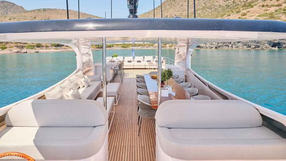 Stylish dining area with a stunning view on deck.