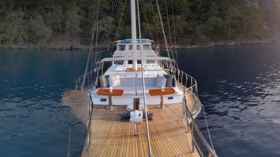 Spacious foredeck of Gulet Simi with cozy seating areas, perfect for enjoying the sea breeze.