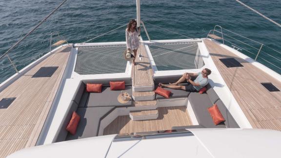 Enjoy a relaxing time with a sea breeze at the front seating area of the 7th Heaven catamaran in Athens.