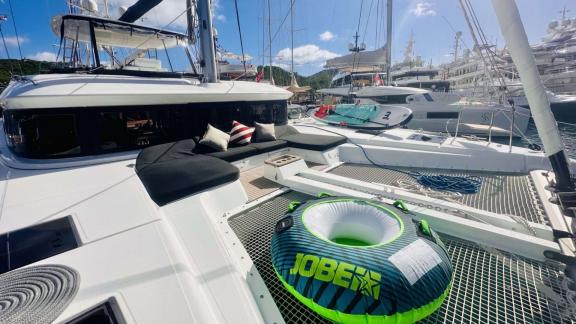 Eldamar’s front deck in Trogir offers padded lounging and a netted sunbed area for relaxing charter moments.