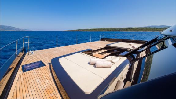 The front deck of Amber One features a sunbathing lounge overlooking Kastela waters.