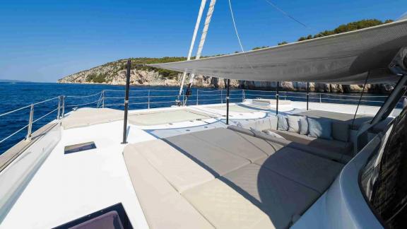 The Solitaire Sunreef 50 catamaran offers spacious lounging by the Kastela coastline.