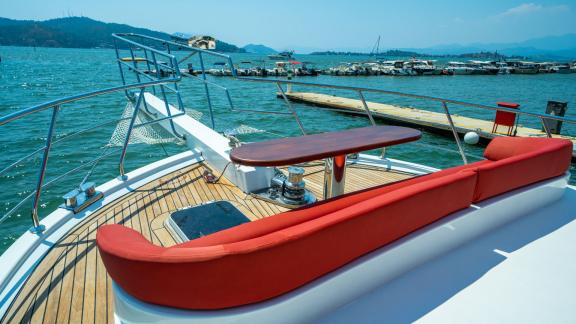 Enjoy the sun on the front sun deck of the yacht Ok Ay with breathtaking views in Fethiye.