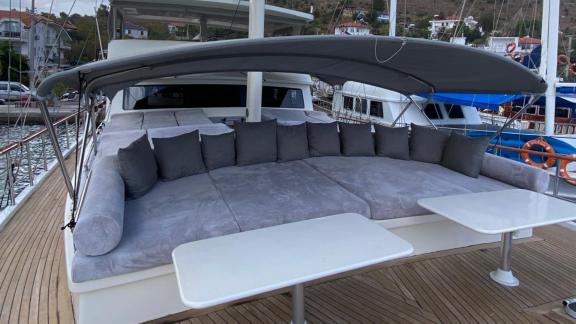 The foredeck of gulet Rose Sah features a cozy seating area with cushions.