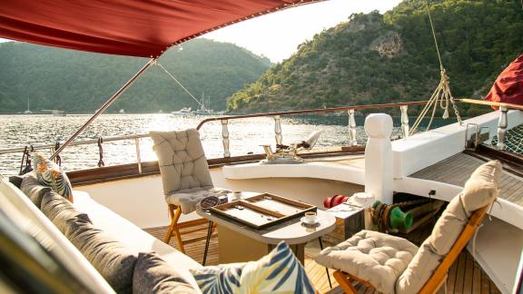 Cozy seating area with a view of the water aboard the Pronto Blue.