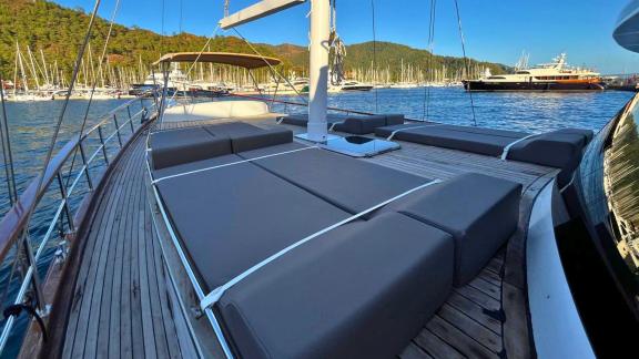 Spacious sunbathing area with comfortable cushions on the deck of Gulet Ahmet Ertürk.