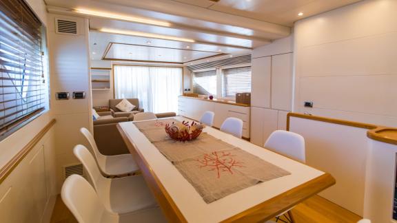 Luxurious and spacious dining area with a motor yacht rental in Naples.