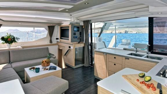 Helidoni charter catamaran offers open-plan kitchen and saloon with ocean panorama.
