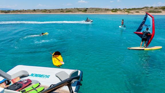 Guests of Motoryacht Freedom enjoy the fun with water toys.