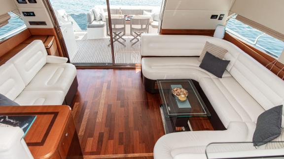 Spacious salon with wood flooring aboard Le Chiffre motor yacht in Šibenik.