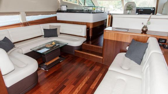Stylish and cozy seating lounge inside Le Chiffre motor yacht, docked in Šibenik.
