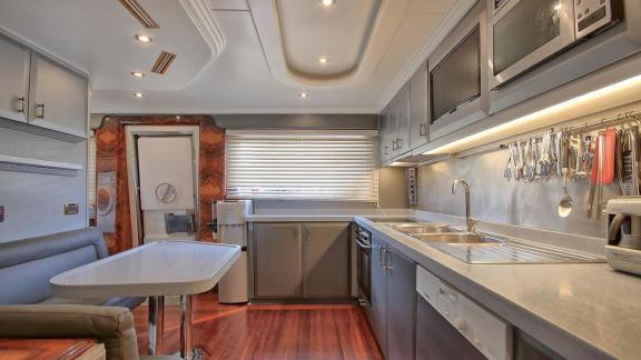 Guests can prepare their own meals on the luxury yacht in the bright kitchen.