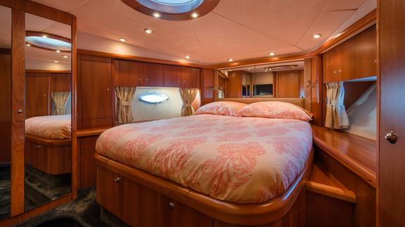 Stylish and comfortable bedroom of the Glorious motor yacht.